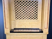 a wooden cabinet with a keyboard on it